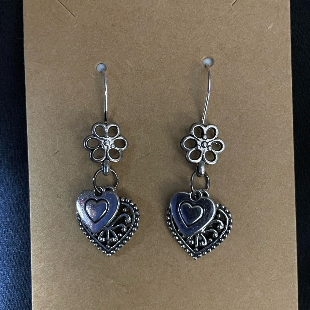 Silver tone heart dangling earrings